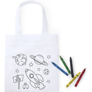 A white tote bag featuring a colouring design of a rocket, planets, and stars, accompanied by colourful crayons.
