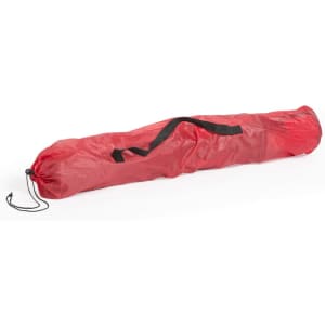A red carrying bag with a black strap, designed for storing and transporting a chair.