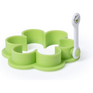 A green silicone mold shaped like a flower with a white handle for easy lifting. Features a logo.