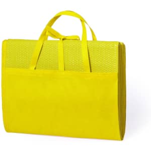 A yellow beach mat with a textured surface, featuring two carry handles for easy transport.