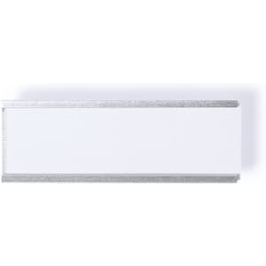 A rectangular name badge with a glossy white surface and a silver glitter border. It features a branding logo.