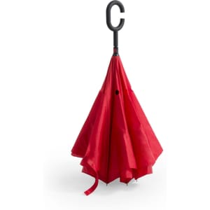 A red reversible umbrella with a C-shaped handle, featuring a simple design and a logo on the handle.