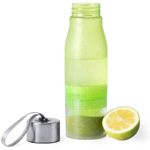 A drink bottle in green with a lemon half beside it and a metal cap with a strap.