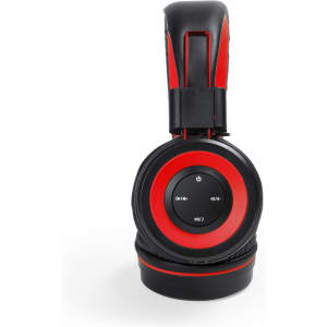 A pair of black and red headphones with a circular control panel on one ear cup, featuring a logo.