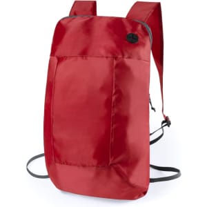 A red foldable backpack with adjustable straps and a button detail. It features a solid colour design.