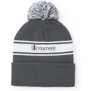 A grey beanie with a pom-pom on top and a logo on the front, featuring white striped details.