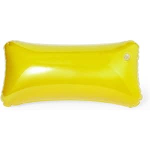 A bright yellow inflatable pillow with a smooth surface and a valve.
