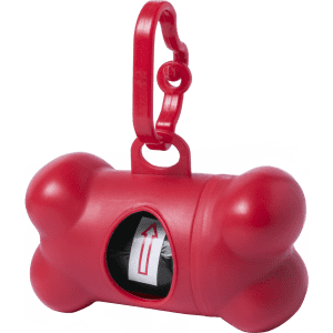 A red bone-shaped waste bag dispenser with a clip for attachment and a roll of bags inside.