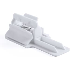 A white phone holder with a spring mechanism and multiple slots for device positioning.