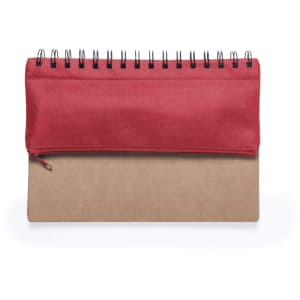 A notepad with a red fabric cover and a brown cardboard base, featuring a spiral binding at the top.