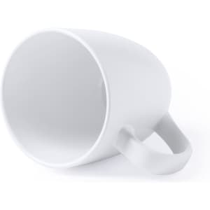 A white coffee mug with a smooth surface and a handle, positioned at an angle on a plain background.