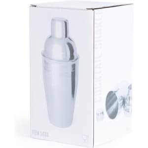 A cocktail shaker in a sleek silver finish, presented in a white box with a logo.