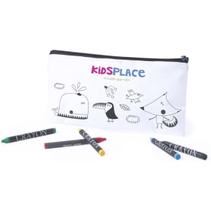 A white pencil case with playful illustrations and a logo, accompanied by several coloured crayons.
