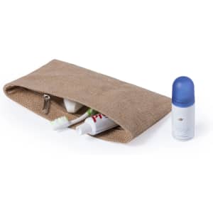 A beige toiletry bag with a zip, containing toothpaste, a toothbrush, and a roll-on deodorant.