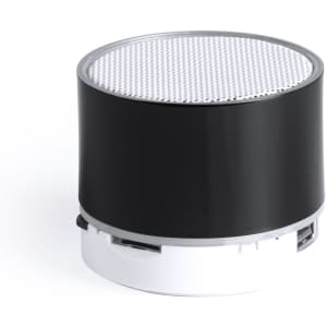 A compact black and white speaker with a textured top and a logo on the front. Perfect for portable audio.