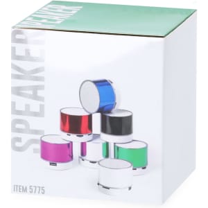 A collection of small speakers in various colours, stacked together, with a box featuring a logo and branding.
