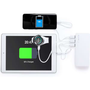 A white Kaprin Power Bank connected to a tablet and smartphone, both displaying battery status indicators.
