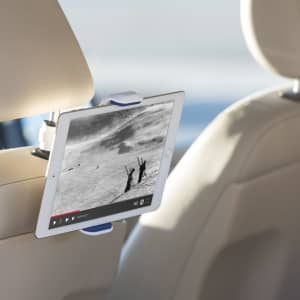 A car phone holder in white and blue, designed to attach to a headrest, holding a tablet or device securely.