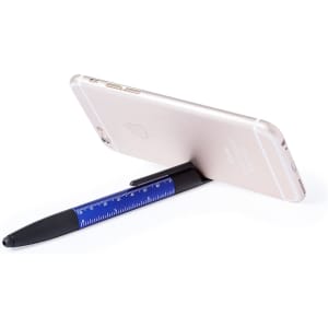 A multifunction pen in black and blue, featuring a ruler, propping up a smartphone.
