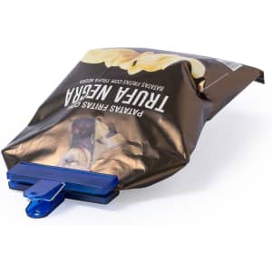 A blue Flint Clip securing a brown bag of chips, featuring a logo.