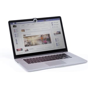 A laptop with a webcam cover attached, featuring a metallic finish and a sleek design.
