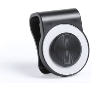 A black and silver webcam cover joystick with a textured circular button, featuring a branding logo.