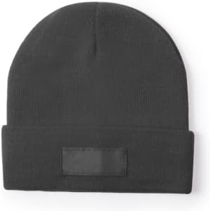 A black beanie made from knit fabric, featuring a fold-up cuff and a blank patch.