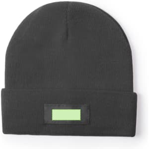 A black beanie with a fold-up cuff and a blank rectangular patch for branding.
