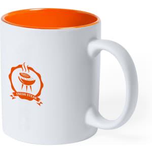 A white coffee mug with an orange interior and handle, featuring a logo on one side.