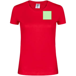 A red women's t-shirt featuring a small green square on the front and has a logo on the label.