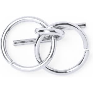A silver metal ring puzzle with interlocking loops and a central bar. It has a shiny, sleek finish.