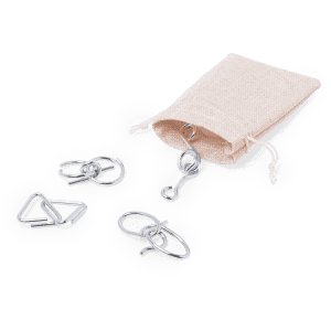 A set of three metal skill game rings in silver, accompanied by a small beige drawstring bag.