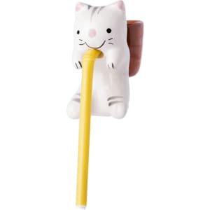 A cat-shaped flowerpot in white and brown, holding a yellow straw. It features a cute, smiling face and has a logo.