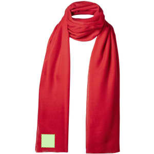 A bright red scarf with a small green logo tag. Ideal as a clothing accessory.