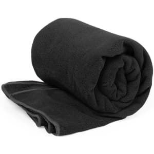 A rolled black absorbent towel, showcasing a textured surface, with a smooth edge. Features a logo.