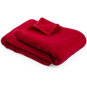 A folded red towel with a soft texture, featuring a small section that is tucked over itself.