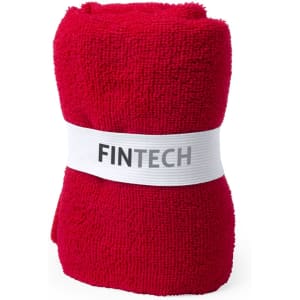 A red absorbent towel wrapped in a white band featuring a logo. Ideal for leisure and outdoor activities.