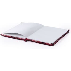 A Velmont notepad with a sequined cover, featuring a red and black colour scheme, opened to blank pages.