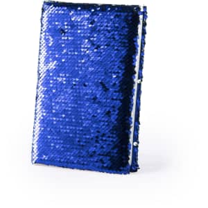 A blue sequin-covered notepad with a shiny, textured surface and a simple design. It features a branding logo.