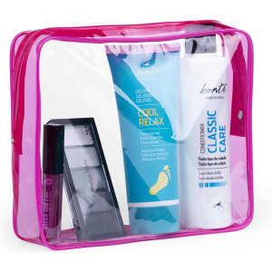A clear toiletry bag in pink containing various beauty products, including hair conditioner and foot gel.