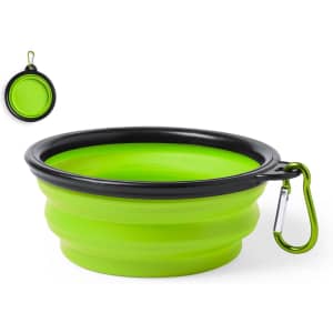 A foldable bowl in bright green with a black rim and a carabiner clip for easy attachment.