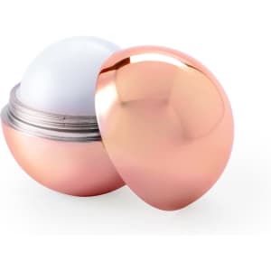 A rose gold lip balm container with a shiny finish, revealing the smooth lip balm inside.