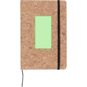 A cork-covered notepad with a green accent panel and a black elastic band. It includes a ribbon bookmark.