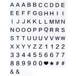 A light box featuring a grid of black letters, numbers, and symbols on a white background.