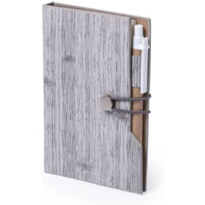A grey notepad with a wooden texture cover, featuring a pen attached to its side. It has a logo on the front.