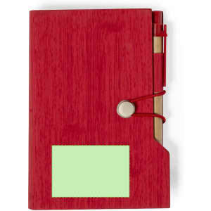 A red notepad with a pen holder and a green sticky notepad attached. Features a logo on the cover.