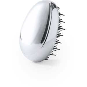 A sleek, silver tramux hairbrush with fine plastic bristles, designed for hair care. It features a curved, ergonomic shape.