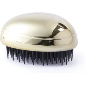 A gold hairbrush with black bristles and a sleek, oval design, featuring a logo on the handle.