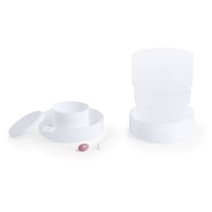 A drink bottle in white, featuring a foldable design with a removable lid and inner cup compartment, also includes a logo.