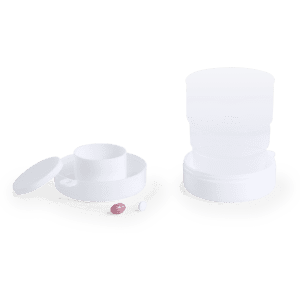 A drink bottle in white, featuring a foldable design with multiple segments and a lid. Includes small coloured pills nearby.